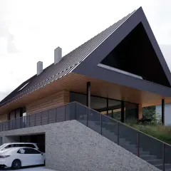 Nowoczesny projekt domu na działkę ze spadkiem terenu, z garażem w bryle budynku i tarasem widokowym.